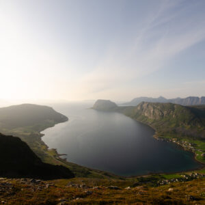 A fjord glowing under backlight at Nontuva, Harstad