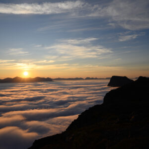 Sunrise light spreading across a cloud sea at Keipen, Grytøya