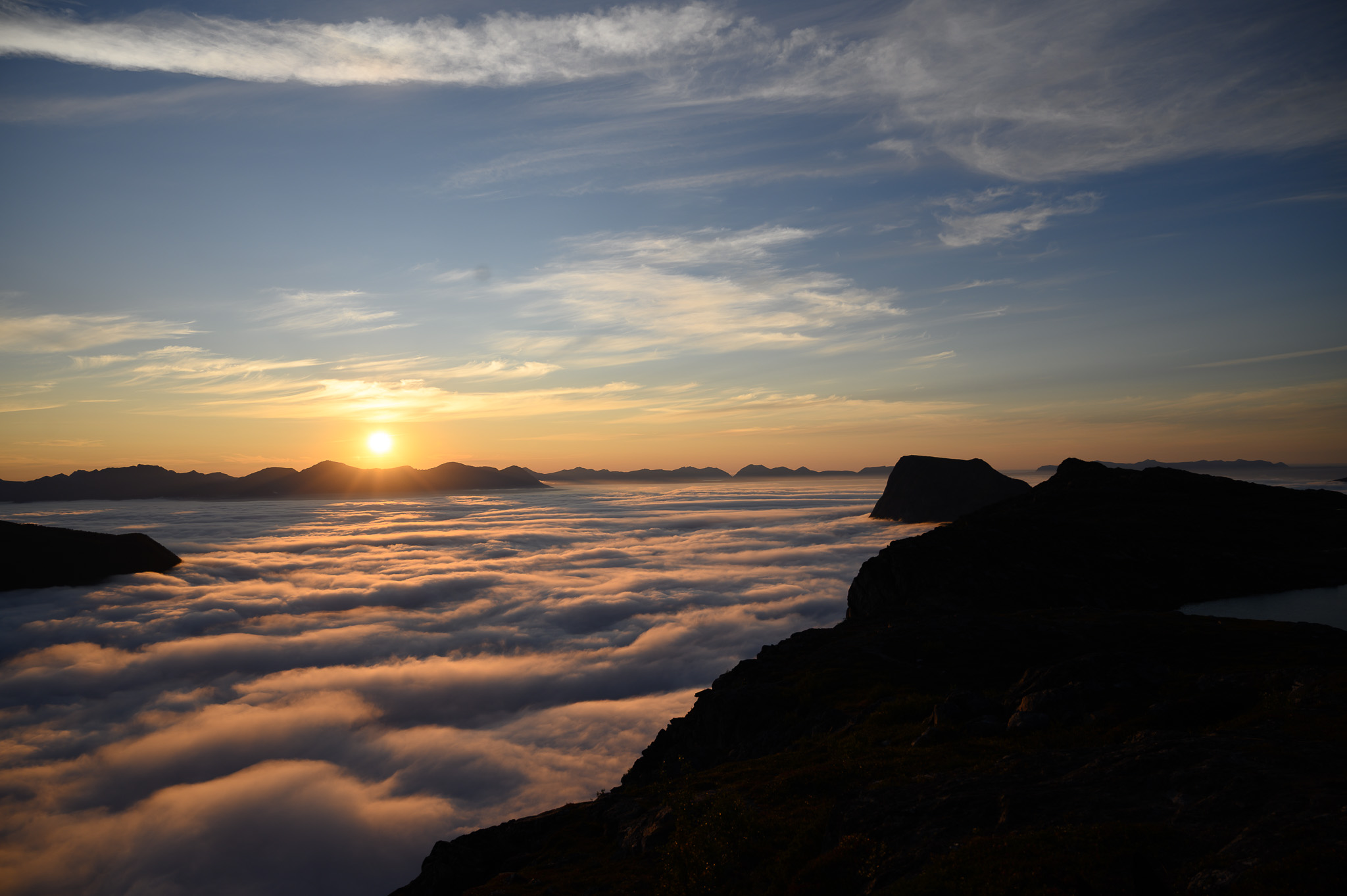 Sunrise light spreading across a cloud sea at Keipen, Grytøya