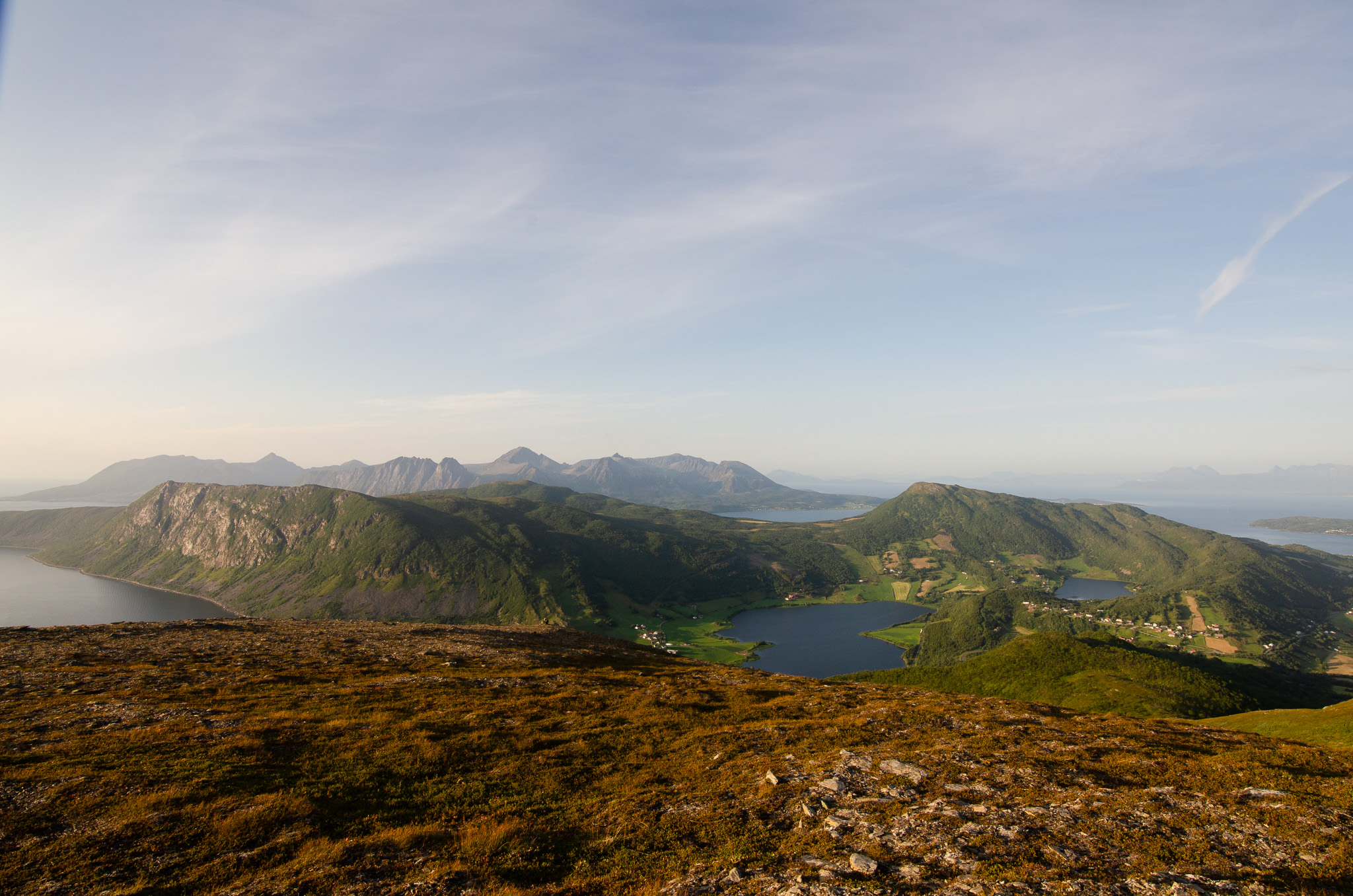 A green ridge falling toward the sea at Nontuva, Harstad