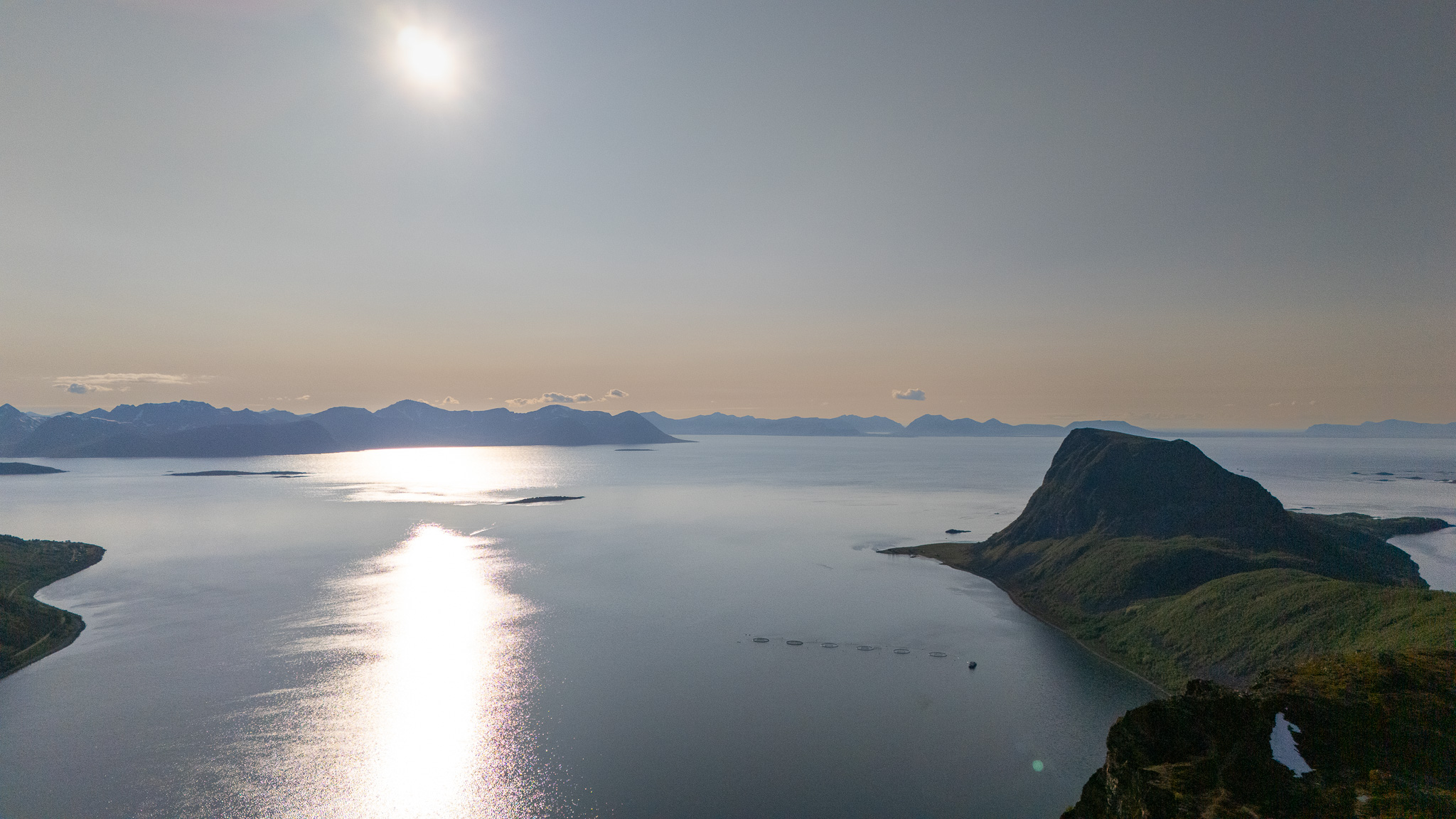 Moonlight across a calm arctic fjord at Keipen, Grytøya