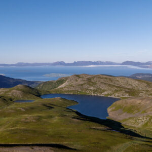 A small mountain lake in green highland at Trøytthågen, Harstad
