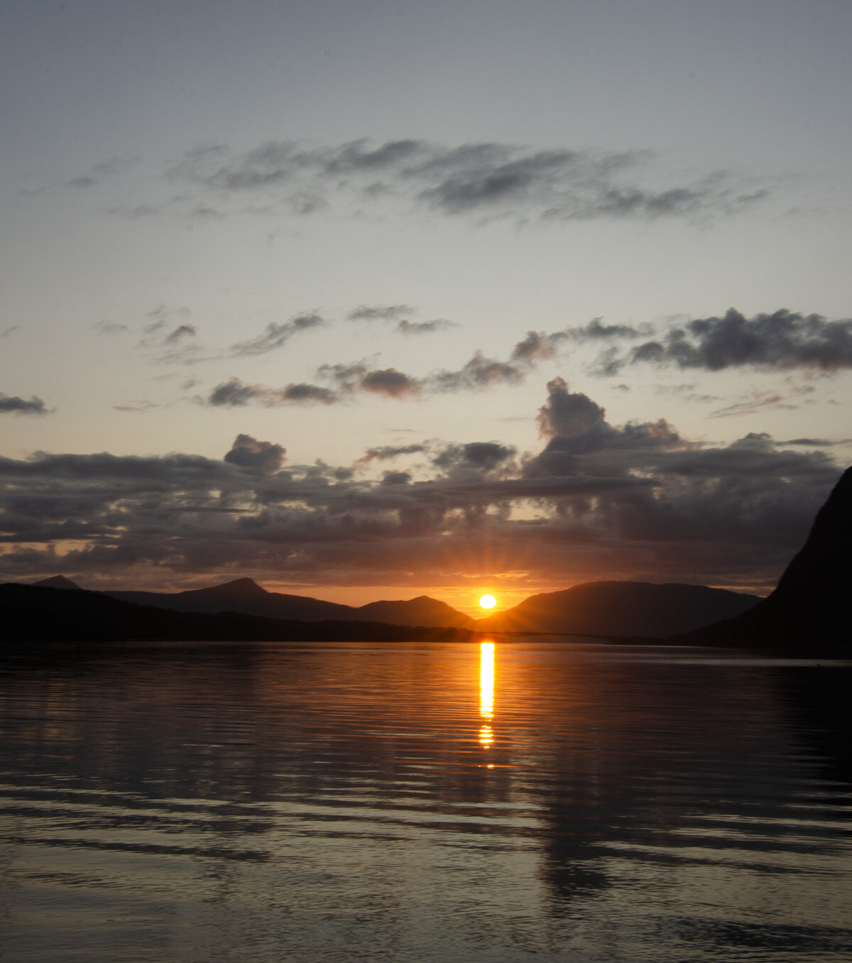 Sun Column on Still Water — Djupfjordbotn