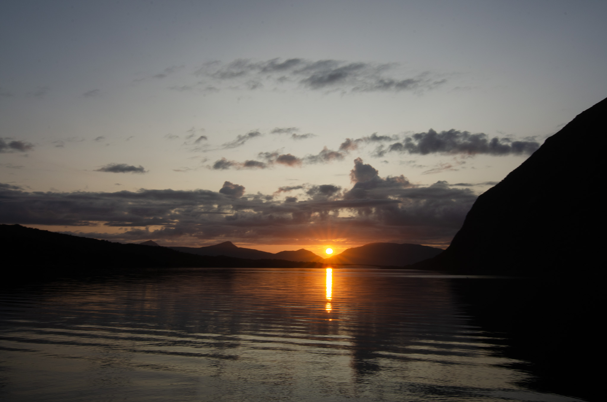 A column of sunlight down a calm fjord at Djupfjordbotn, Djupfjorden