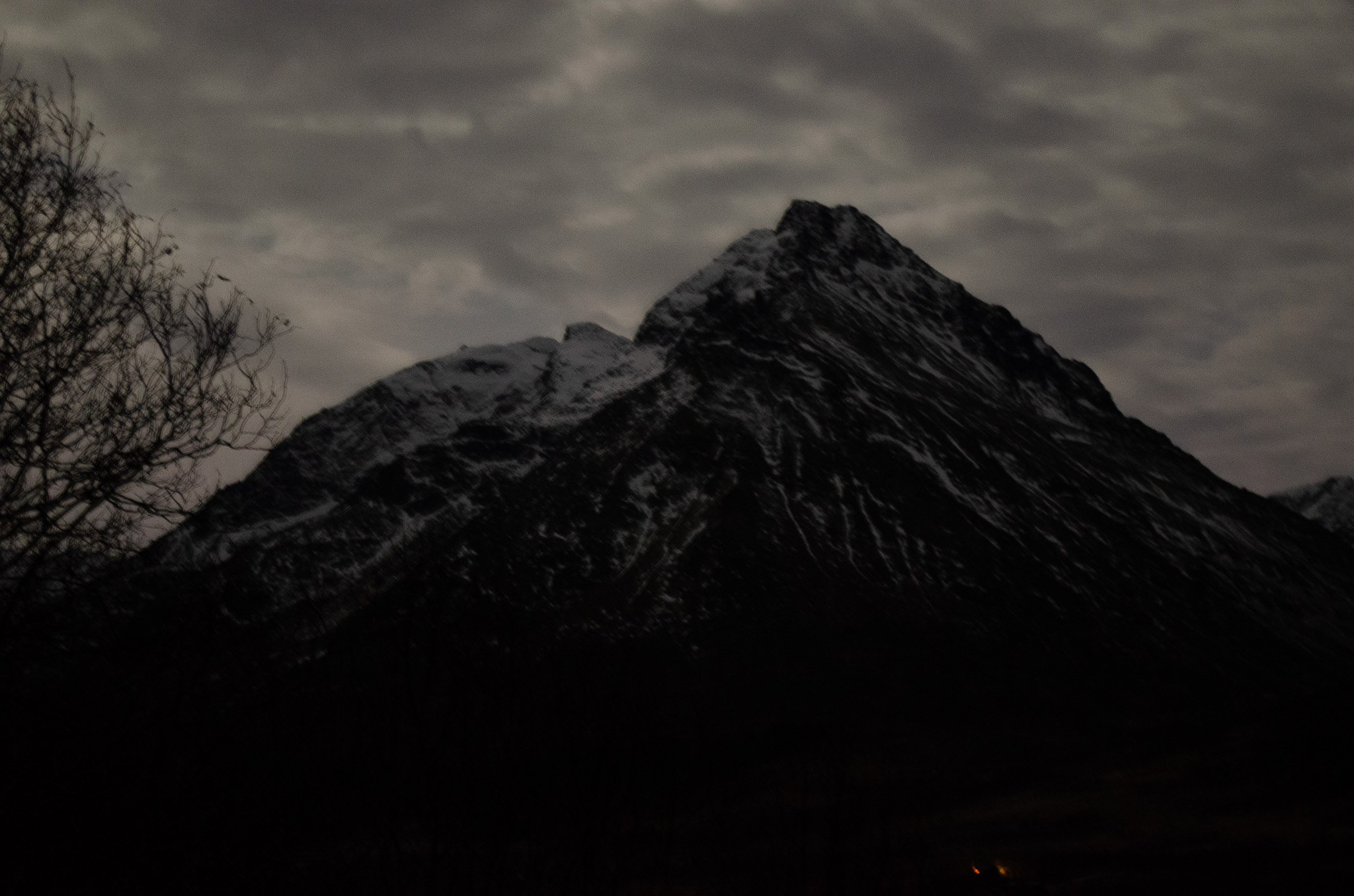 A black pyramid peak against the sky at Skålneset, Sørfjorden
